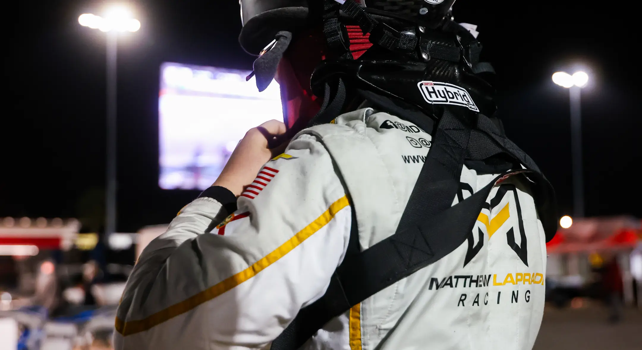 Matthew in race suit with Matthew Laprade Racing branding