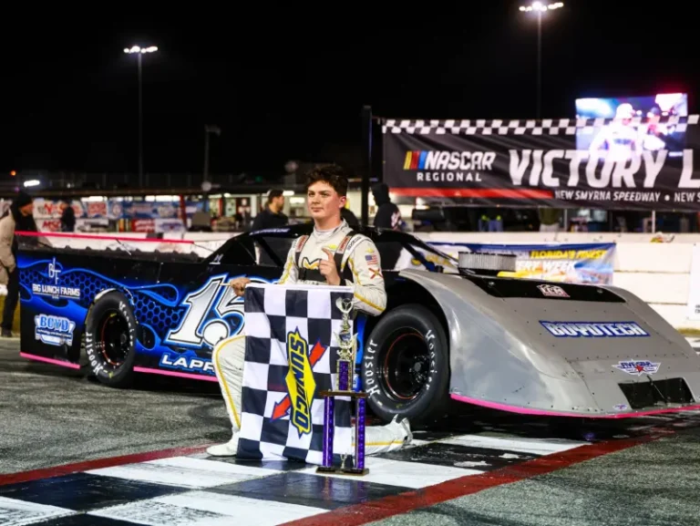 Matthew in victory lane with trophy
